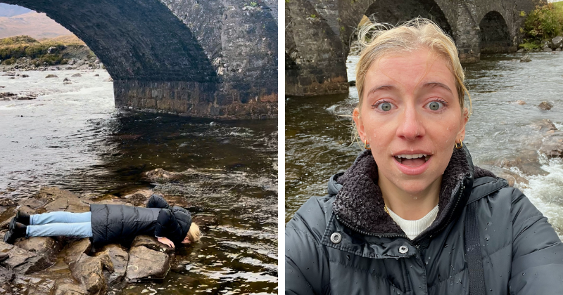 A woman dunking her face in a river