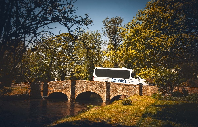 rabbies bus on small stone bridge