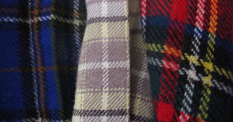 a close up of three different Scottish tartans next to each other