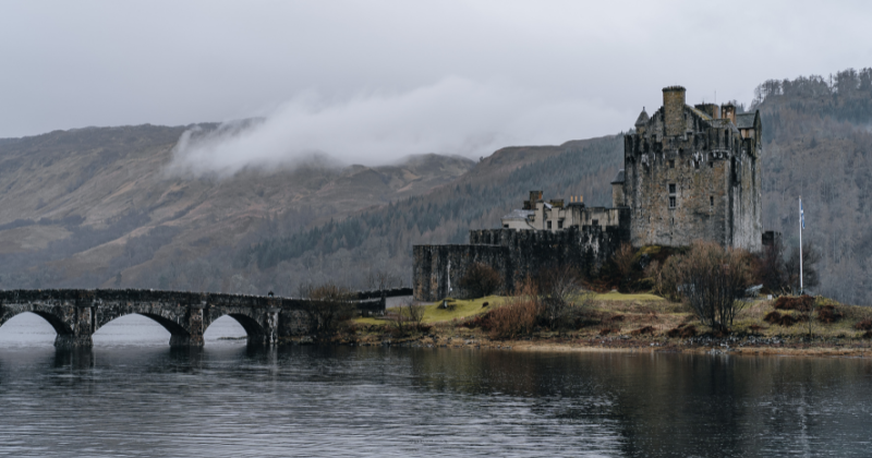 A bridge leading to a castle on a small island