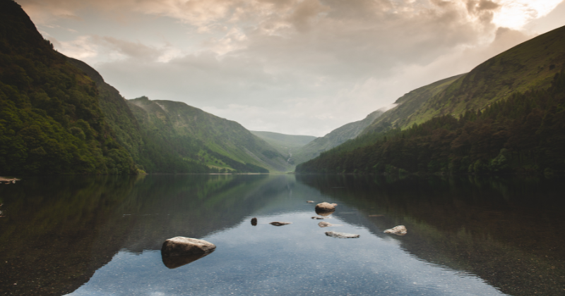 A lake with a mountain on either side