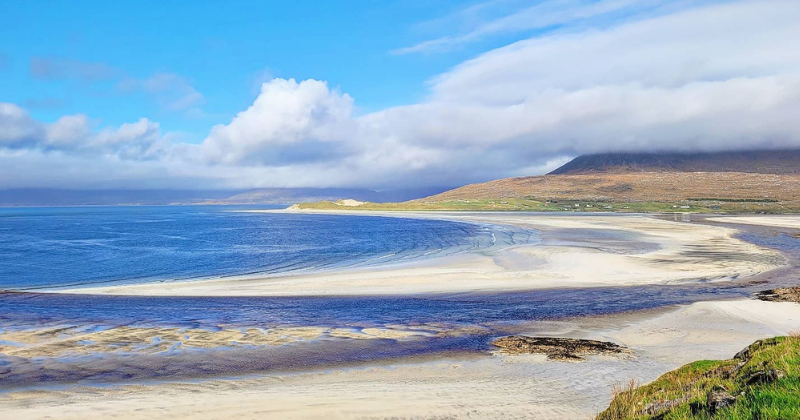 A beautiful beach with blue water and white sand