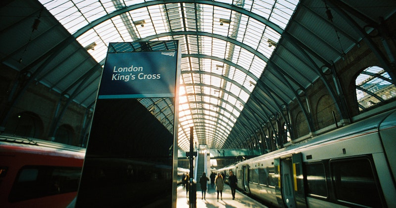 a sign and the platform at London King's Cross, one of the most famous train stations in England.